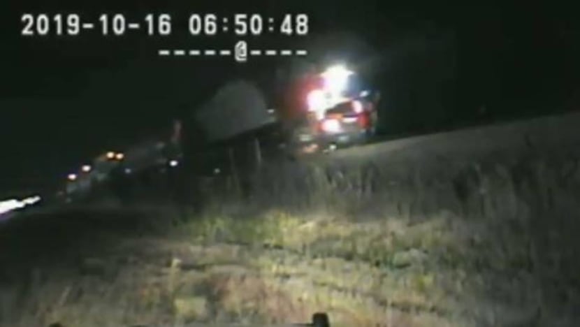 US cop pulls man from car seconds before train hits it US cop pulls man from car seconds before train hits it