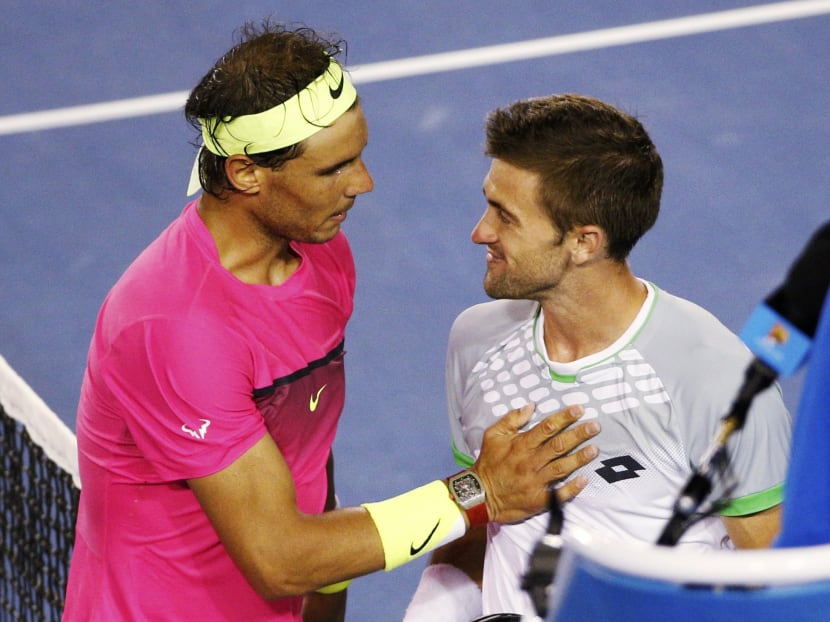 Gallery: Smyczek’s sporting play earns respect from Nadal