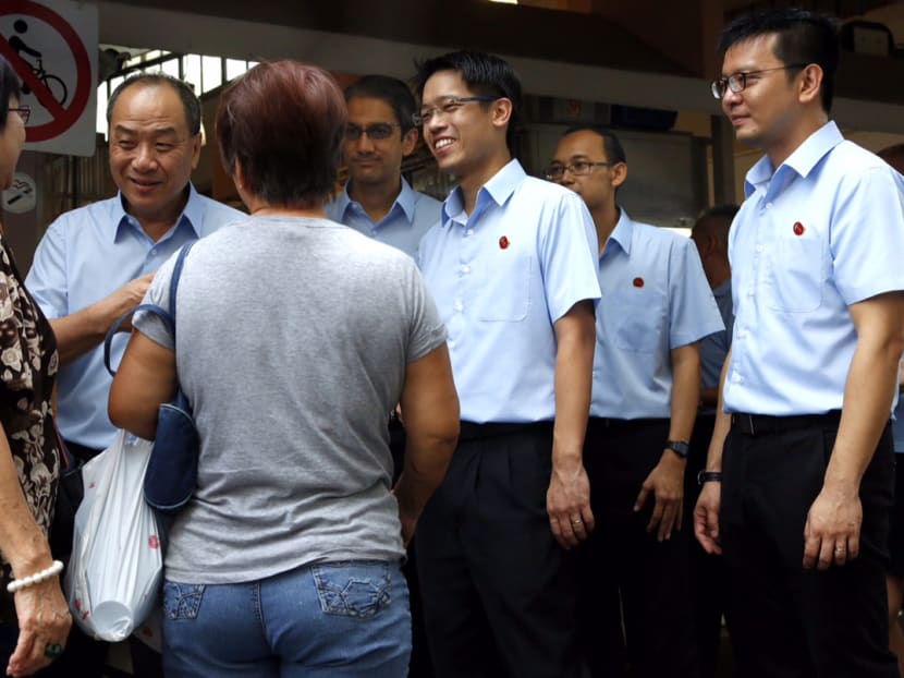Wp Secretary General Low Thia Khiang(L) speaking to residents outside the market at new Upper Changi road. With him are WP candidates for East Coast Leon Perera, Gerald Giam, Mohamed Fairoz Bin Shariff and Daniel Goh. Photo: Raj Nadarajan
