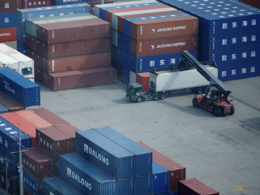 A truck moves a shipping container at Pyeongtaek port in Pyeongtaek, South Korea, July 9, 2020. REUTERS/Kim Hong-Ji/Files