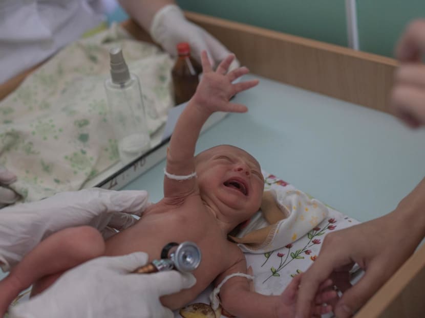 Ms Marina Tupata, 26, watches as her six-day-old baby Sofia is examined inside Pokrovsk maternity hospital, Donetsk region, eastern Ukraine on June 29, 2022. Ms Marina Tupata, 26, watches as her six-day-old baby Sofia is examined inside Pokrovsk maternity hospital, Donetsk region, eastern Ukraine on June 29, 2022.