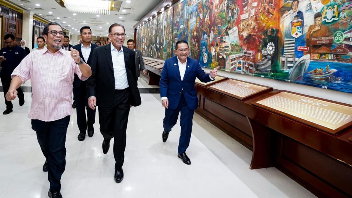 In historic return to UMNO headquarters, Anwar says Malaysia unity government will face upcoming state polls together