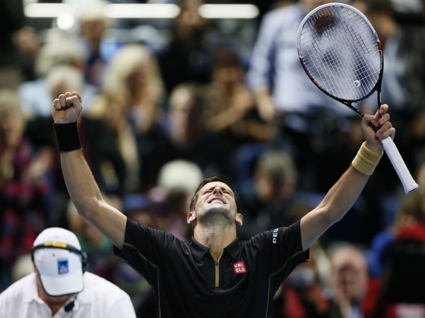 Novak Djokovic of Serbia celebrates winning his tennis match against Tomas Berdych of Czech Republic at the ATP World Tour Finals at the O2 Arena in London Nov 14, 2014. Photo: Reuters