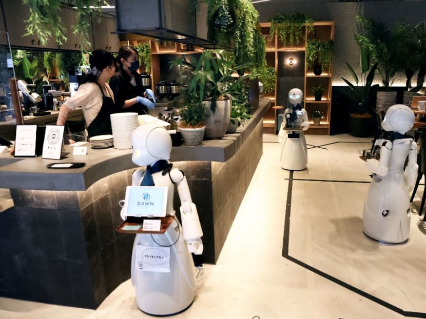 Humanoid robots which which can deliver drinks to customers at the Dawn Cafe in Tokyo.