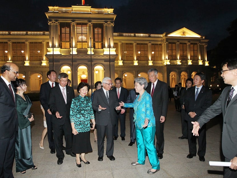 Temasek Holdings' executive director and chief executive Ho Ching (in blue) and Temasek's chairman Lim Boon Heng (fourth from left) welcoming guest-of-honour President Tony Tan and his wife Mary (centre) to Temasek's 40th anniversary dinner, held at the Istana yesterday. Also present were (from left) Deputy Prime Minister Tharman Shanmugaratnam and his wife, Deputy Prime Minister Teo Chee Hean and Prime Minister Lee Hsien Loong. Photo: Ooi Boon Keong