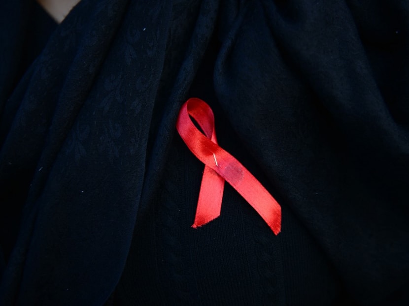 A Nepalese woman wearing an Aids awareness ribbon takes part in an event to mark the eve of World Aids Day in Kathmandu on Nov 30, 2016.
