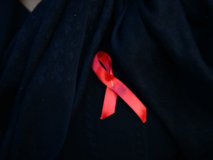 A Nepalese woman wearing an Aids awareness ribbon takes part in an event to mark the eve of World Aids Day in Kathmandu on Nov 30, 2016. A Nepalese woman wearing an Aids awareness ribbon takes part in an event to mark the eve of World Aids Day in Kathmandu on Nov 30, 2016.