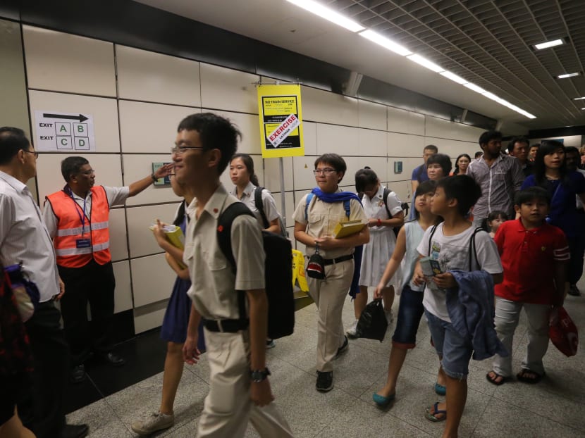 Commuters at an MRT station. Photo: Ooi Boon Keong
