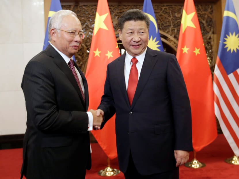 Malaysia's Prime Minister Najib Razak (left) meets China's President Xi Jinping at the Diaoyutai State Guesthouse, in Beijing. Photo: REUTERS
