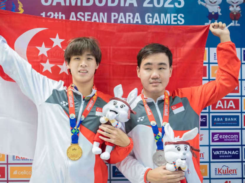 Colin Soon (left) and Wong Zhi Wei pose with their ASEAN Para Games medals at the Morodok Techo National Stadium in Phnom Penh on June 5, 2023.