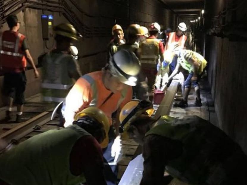 Engineers work to clear a flooded tunnel between Braddell and Bishan MRT stations on Oct 7. Photo: LTA