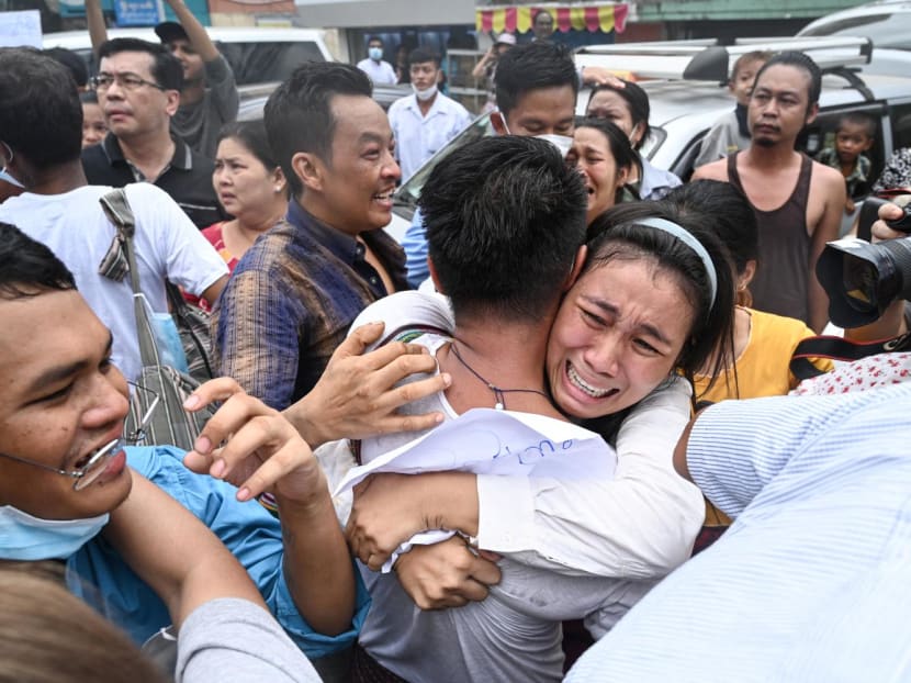 A man celebrates with a relative after being released from Insein Prison in Yangon, Myanmar, on May 3, 2023