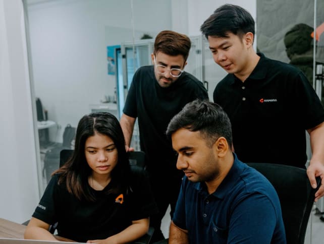 Mr Leong Yong Shin, director, Augmentus (far right), believes that providing frequent and regular consultations is key to ensuring trainees develop confidence and skills to achieve their goals. Photo: Augmentus