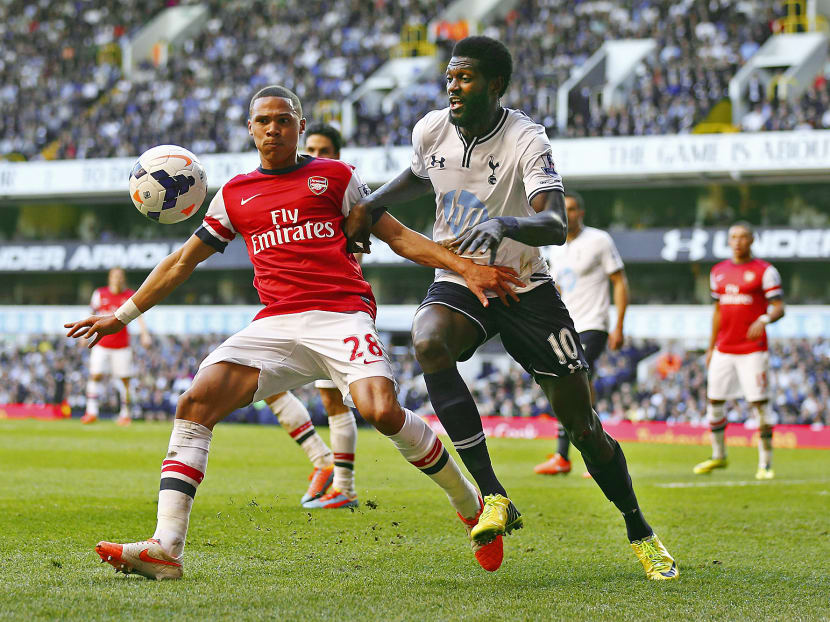 Adebayor (right) would love to get a goal against his old club Arsenal to make up for Spurs’ 1-0 loss to the Gunners in March. PHOTO: GETTY IMAGES