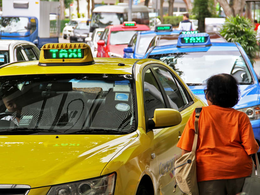 A taxi picking up a customer at Velocity (Novena). TODAY file photo