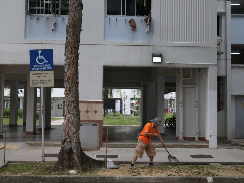 An estate cleaner seen sweeping at a block of flats along Yishun Avenue 2.
