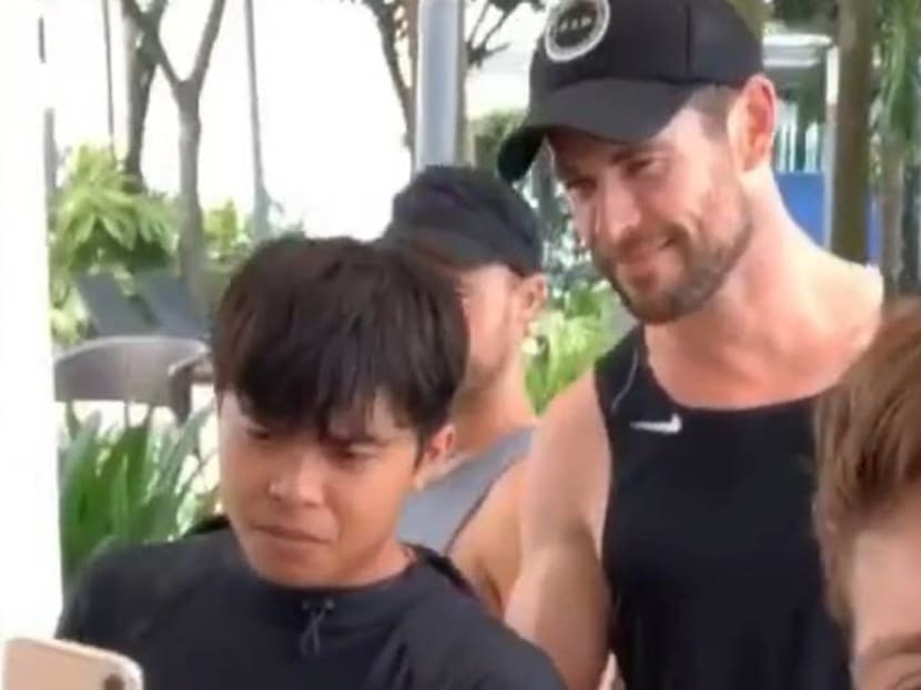 Chris Hemsworth can't walk very far in Singapore without stopping for fans