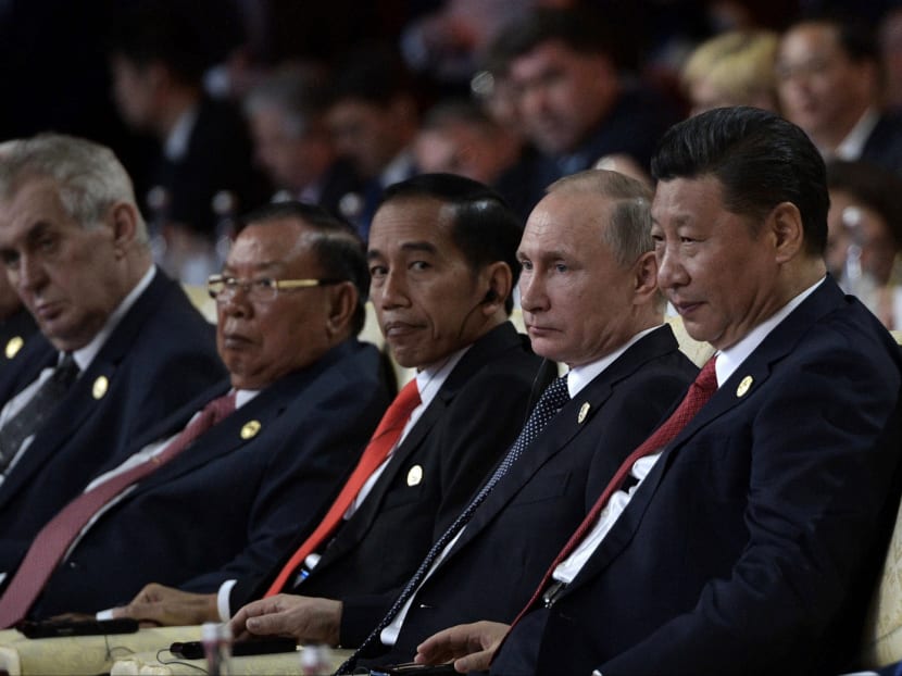 Russian President Vladimir Putin, second right, and Chinese President Xi Jinping, right, take part at the opening ceremony of the Belt and Road Forum in Beijing. AP file photo