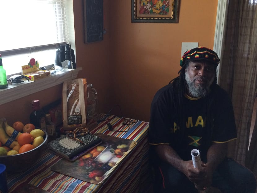 In this March 10, 2016 photo, Mr Baba Ken Amen, an artist and vegan caterer, poses for a photo at his home in Pontchartrain Park in New Orleans. Photo: AP In this March 10, 2016 photo, Mr Baba Ken Amen, an artist and vegan caterer, poses for a photo at his home in Pontchartrain Park in New Orleans. Photo: AP