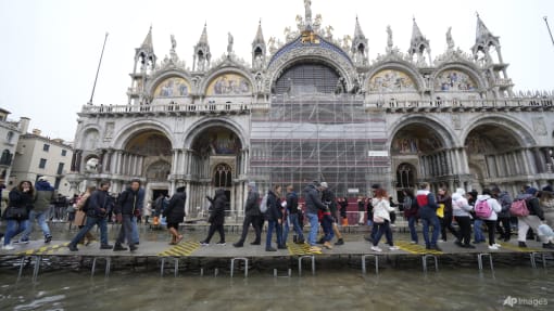 Climate activists pour mud and chocolate milk on St Mark's Basilica in Venice