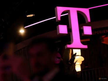 FILE PHOTO: The logo of Deutsche Telekom is pictured at the GSMA's 2023 Mobile World Congress (MWC) in Barcelona, Spain February 28, 2023. REUTERS/Nacho Doce
