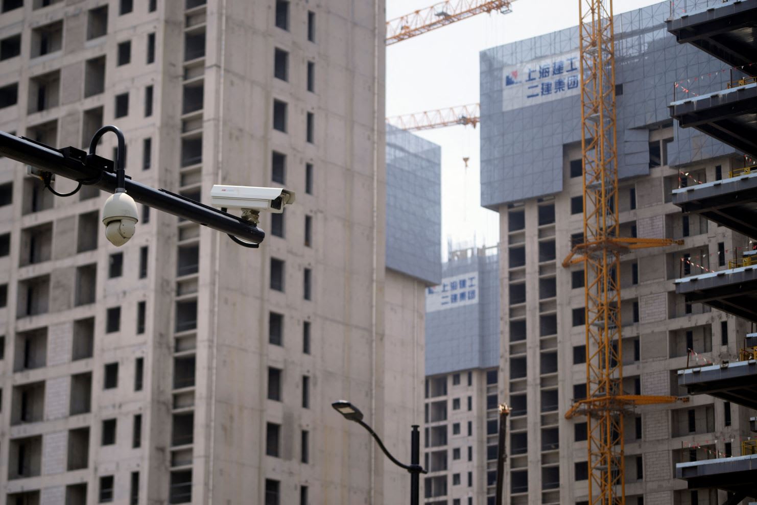 <p>Surveillance cameras are seen near residential&nbsp;buildings under&nbsp;construction&nbsp;in&nbsp;Shanghai, China on July 20, 2022.&nbsp;</p>
