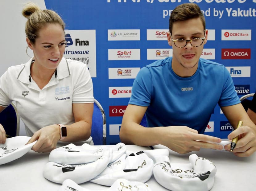 Emily Seebohm (left) and Mitch Larkin at a meet-and-greet session at Kallang Wave Mall yesterday. Photo: Wee Teck Hian