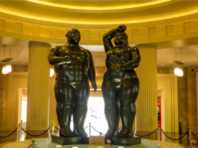 The bronze sculptures depict a version of Adam and Eve in Colombian artist Fernando Botero's signature rotund style.