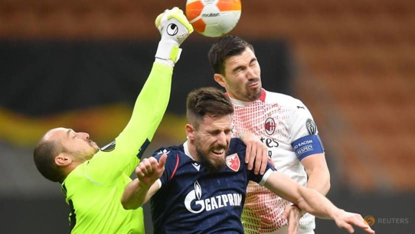 Football: Milan limp through on away goals after draw with Red Star Football: Milan limp through on away goals after draw with Red Star