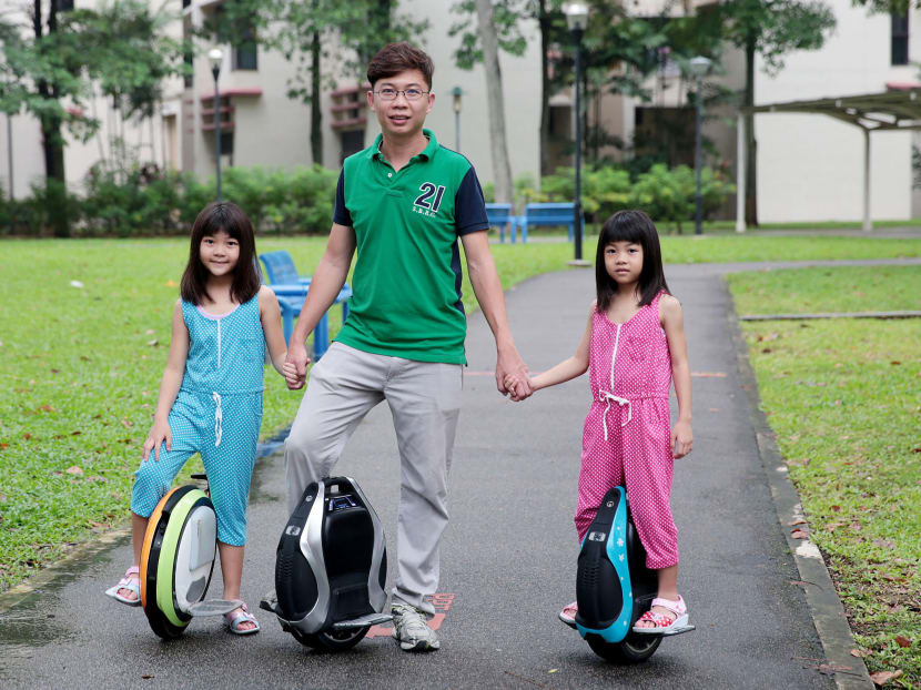 Mr Jeffrey Chan and his daughters Juel (in blue) and Kyae on unicycles. A growing group of people are zipping around Singapore on Personal Mobility Devices as part of their daily commute. Photo: Jason Quah Mr Jeffrey Chan and his daughters Juel (in blue) and Kyae on unicycles. A growing group of people are zipping around Singapore on Personal Mobility Devices as part of their daily commute. Photo: Jason Quah