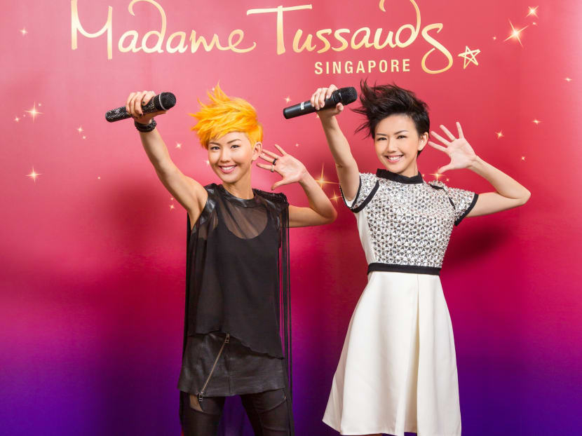 Stefanie Sun poses with her wax figure, the first Singapore celebrity unveiled for the new Madame Tussauds Singapore attraction opening here on Oct 25.