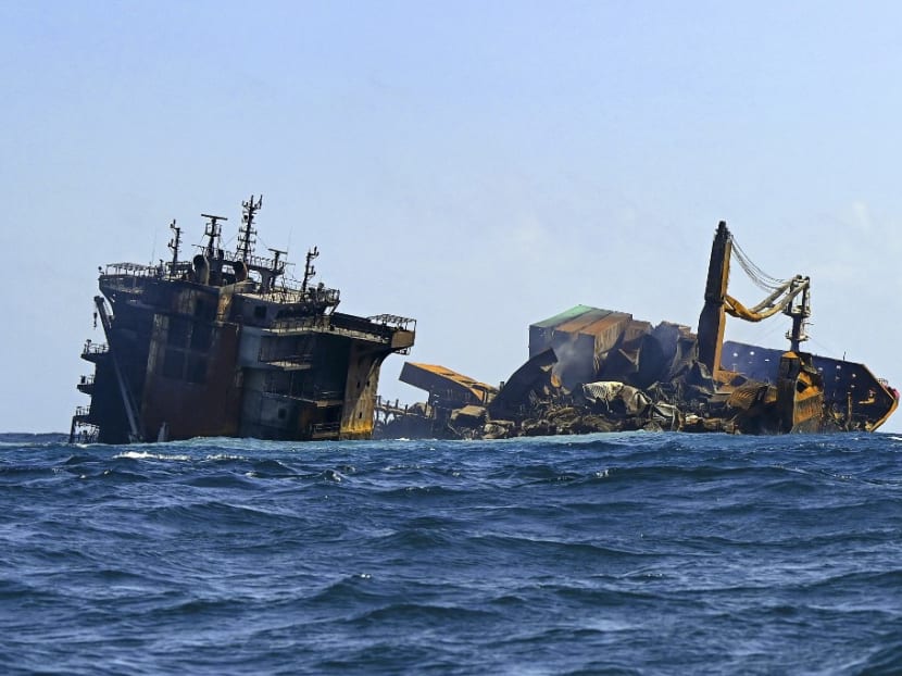 In this file photo taken on June 2, 2021 the Singapore-registered container ship MV X-Press Pearl sinks after burning for almost two weeks outside Colombo's harbour.