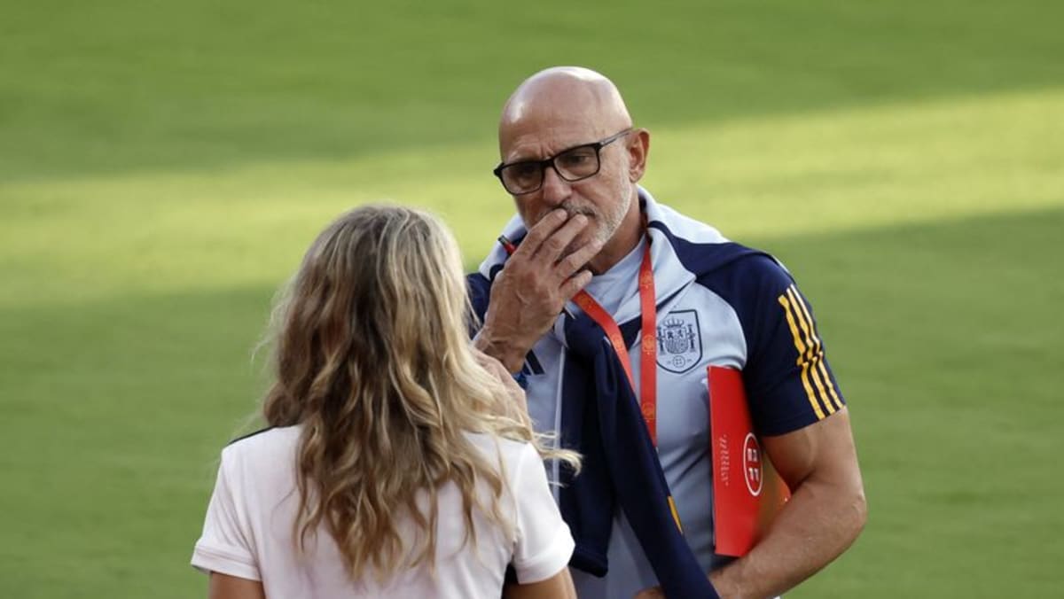 Spain's men's coach sticks to football amid kiss furore - CNA