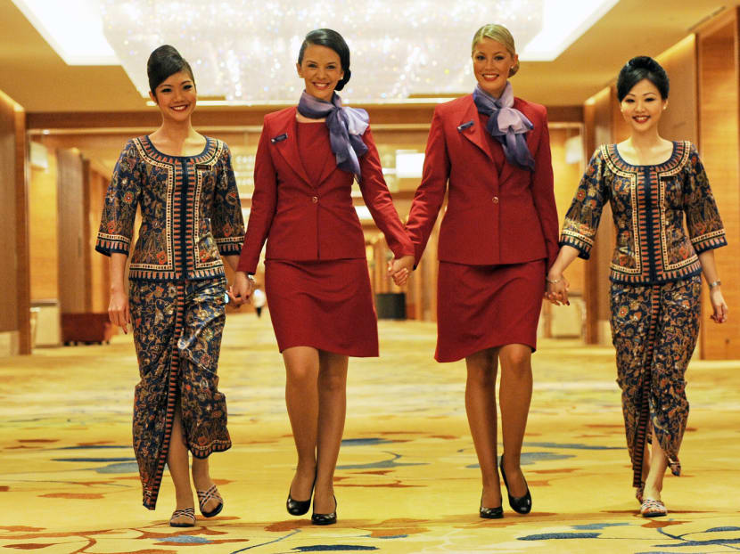 Singapore Airlines (SIA) and Virgin Australia flight attendants. An SIA spokesman said its interests in the Australian market are best served through an independent Virgin Australia. Photo: AFP