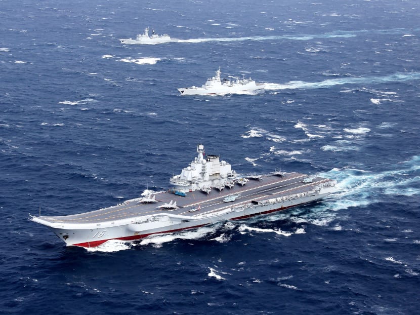 File photo of China’s Liaoning aircraft carrier with an accompanying fleet conducting drills in the South China Sea. Photo: Reuters