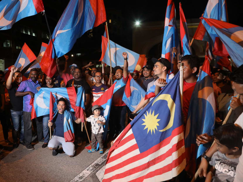 Pakatan Harapan supporters singing and chanting outside the Istana Negara, while waiting for the swearing-in ceremony of Malaysia's seventh Prime Minister, Dr Mahathir Mohamad on May 10, 2018.