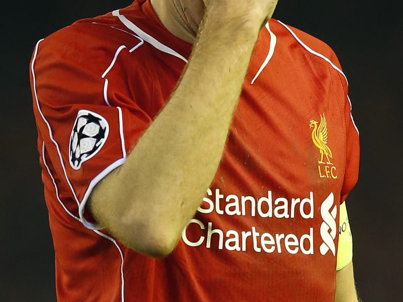 Liverpool's Steven Gerrard touches his head during the Champions League Group B soccer match between Liverpool and FC Basel. Photo: AP