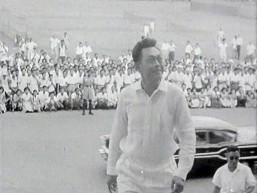 Lee Kuan Yew climbs up the steps at the City Council Chambers following the People's Action Party's (PAP) win in the national elections in Singapore in this file still image taken from video June, 1959. Photo: Reuters