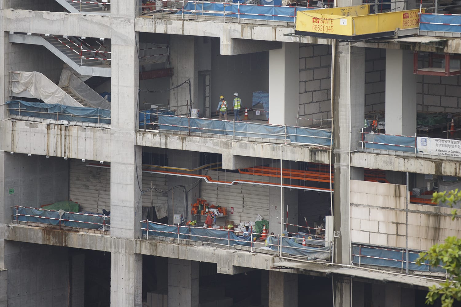 Workers at a construction site along Jalan Bukit Merah on May 13, 2022. Workers at a construction site along Jalan Bukit Merah on May 13, 2022.