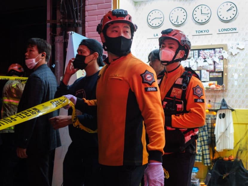This picture taken on Oct 30, 2022 shows emergency workers setting up a cordon line after a Halloween incident in the district of Itaewon in Seoul. This picture taken on Oct 30, 2022 shows emergency workers setting up a cordon line after a Halloween incident in the district of Itaewon in Seoul.
