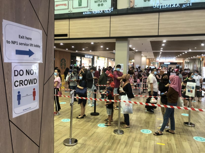 A queue of around 30 to 50 people were waiting to be screened at Northpoint City mall in Yishun at 6.30pm on June 23, 2020.