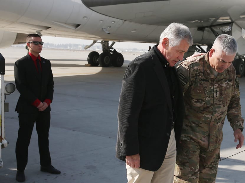 US Secretary of Defense Chuck Hagel is greeted by Gen. John F. Campbell (R) after arriving in Kabul. Photo: AP