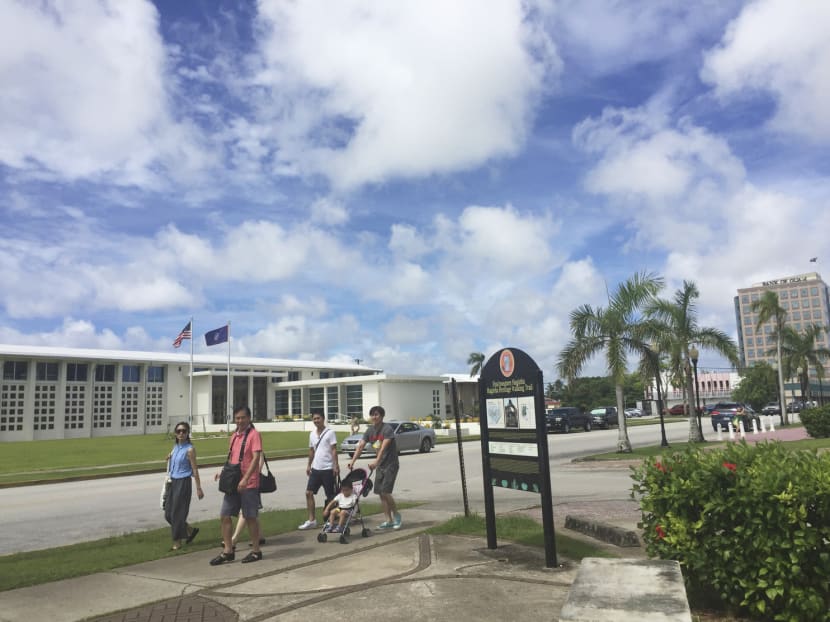 People walking around Hagatna, Guam, yesterday. In recent months, American strategic bombers from Guam’s Andersen Air Force Base have flown over the Korean Peninsula in a show of force. Photo: AP