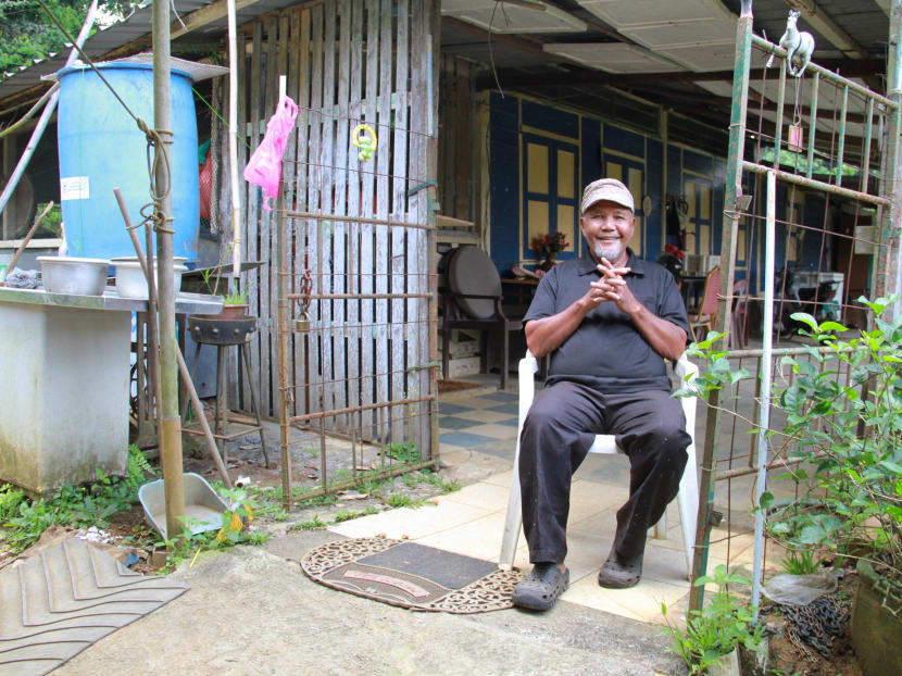 Ahmad Kassim, 82, has been living on Pulau Ubin for 75 years. He fleed to the island from Johor during World War II.  To this day, he still lives in the house that his father built. Photo: Esther Leong/TODAY