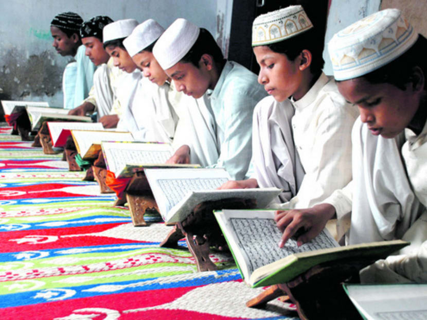 Muslim children reading the Quran at a madrasah in India. Some Indian Muslim leaders have accused the BJP of pursuing a fundamentalist Hindu agenda with the crackdown on madrasahs. Photo: REUTERS