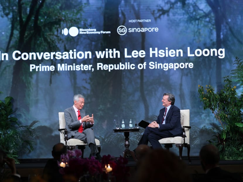 Prime Minister Lee Hsien Loong with Bloomberg News Editor-in-Chief John Micklethwait at the Bloomberg New Economy gala dinner on Nov 17, 2021.