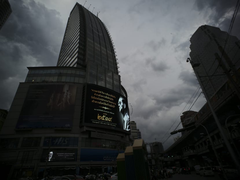 Images of the late Thai King Bhumibol Adulyadej are projected on electronic billboards above an intersection in Bangkok. As Thailand prepares for King Bhumibol Adulyadej’s cremation ceremony Thursday, his image is omnipresent across the country in messages commemorating his life and mourning his death. Photo: AP