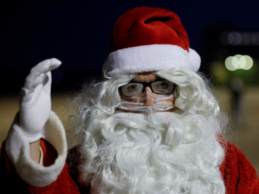 A man dressed as Santa Claus wears a protective face mask during an annual meeting of a rent-a-Santa Claus and Angel service at the former Berlin-Tempelhof airfield, amid the Covid-19 outbreak in Berlin, Germany on Dec 5, 2020.