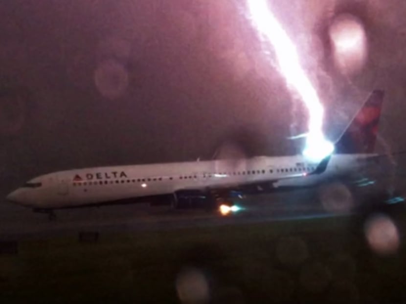Screengrab from YouTube of the Delta plane getting struck by lightning. Photo: Jack Perkins/YouTube
