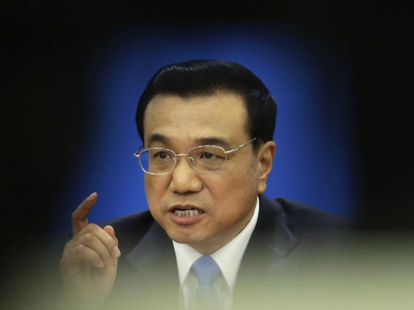 China's Premier Li Keqiang gestures during a news conference after the closing session of the National People's Congress (NPC), China's Parliament, at the Great Hall of the People, in Beijing, today. Photo: Reuters